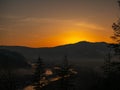 Beautiful landscape stones in mountain lake, reflection, blue sky and yellow sunlight in sunrise. Ukraine. Amazing scene