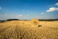 Beautiful landscape with straw bales in harvested fields Royalty Free Stock Photo