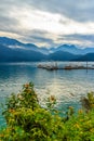 Beautiful Landscape of Sun Moon Lake in the morning with mountain background and yellow flower foreground at Nantou, Taiwan