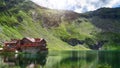 Beautiful landscape sun over mountains with lake between mountains Lacul Balea Transfagarasan