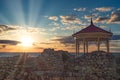 Beautiful landscape with sunset and Royal gazebo on the background of the sea landscape Royalty Free Stock Photo