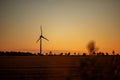 beautiful landscape at sunset. windmill in the field Royalty Free Stock Photo