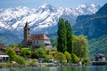 Church with snowy alps over Brienz lake in Switzerland Royalty Free Stock Photo