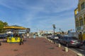 Beautiful landscape town view of one of Willemstad`s street. Queen Emma pontoon Bridge on blue sky background.