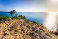 Beautiful Landscape and Tropical over the blue sea and Cape with sailboat in the background and rock cape foreground and the sunli