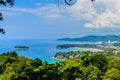 Beautiful landscape of turquoise ocean waves with boats, coastline and blue sky background from high aerial view point Royalty Free Stock Photo