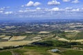 Beautiful landscape in Tuscany - wave hills covered green grass. Tuscany, Italy Royalty Free Stock Photo