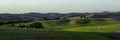 Beautiful landscape in Tuscany - wave hills covered green grass. Tuscany, Italy Royalty Free Stock Photo