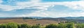 Beautiful landscape in Tuscany - wave hills covered green grass. Tuscany, Italy, Europe Royalty Free Stock Photo