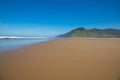 beautiful big beach with sand mountain sea and blue sky in Asturias