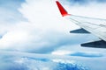 Beautiful landscape view background of sky above cloud  plane`s window and see plane`s wing Royalty Free Stock Photo