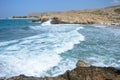 Beautiful landscape view of big waves and a rocky beach of Crete