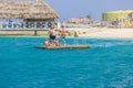 Beautiful landscape view of Hotel, with a beach, a floating pier featuring a group of tourists.