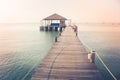 Beautiful landscape view of long wooden bridge into the sea and pavilion. Royalty Free Stock Photo