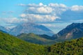 beautiful landscape with a view of the mountains covered with forest on a bright sunny day Royalty Free Stock Photo