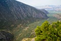 Beautiful landscape view of Parnassus mountain, green olive groves path through Itea town and Ionian sea with blue sky background Royalty Free Stock Photo