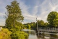 Beautiful landscape view of river with green forest trees on both sides on blue sky background Royalty Free Stock Photo