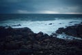 Beautiful landscape view of the rocky coast of the Atlantic Ocean during a cloudy sunset. Spain Royalty Free Stock Photo