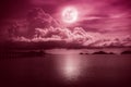 Beautiful landscape view of the sea. Colorful red sky with clouds and bright full moon on seascape to night. Serenity nature Royalty Free Stock Photo