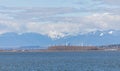 Beautiful landscape view of the sea and the Richmond city in British Columbia and beautiful mountains on the background Royalty Free Stock Photo