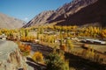 Small village in Gupis valley against Hindu Kush mountain range in autumn Royalty Free Stock Photo