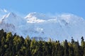 Landscape view of snowy mountain peak with cloud and blue sky background at Yading National Reserve, Sichuan, China Royalty Free Stock Photo