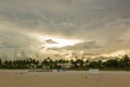 Beautiful landscape view of sunset Miami South Beach coast line. Sand beach, Atlantic Ocean, people on blue sky background.