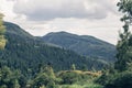 Beautiful landscape view to the Colorado mountains with green forests and snow on top, mountain river. Small village in Aspen Royalty Free Stock Photo