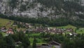 Beautiful landscape view of the valley of waterfalls, roofs of traditional swiss houses, mountain - Swiss Alps, green