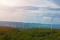 Beautiful landscape view of wind power turbine among mountain hill with blue sky in the early morning, Wind turbines on sunny Royalty Free Stock Photo