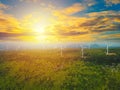 Beautiful landscape view of wind power turbine among mountain hill with blue sky in sunset  Wind turbines on sunny evening with Royalty Free Stock Photo