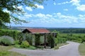 Idyllic landscape in southern Germany with a tiled garden house in the foreground