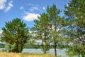 Beautiful landscape by the water. Spring summer landscape blue sky clouds river  green trees Royalty Free Stock Photo