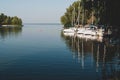 landscape of white boats on river near trees in yachts club Royalty Free Stock Photo