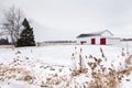Beautiful landscape with white and red old barn seen in winter in the rural part of Saint-Augustin-de-Desmaures Royalty Free Stock Photo
