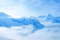beautiful landscape winter snow covered peaks of Caucasus mountain, Dombaj with clouds and blue sky, close up Royalty Free Stock Photo
