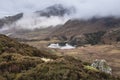 Beautiful landscape Winter sunrise of Blea Tarn from Side Pike in English Lake District with low level clouds over mountain tops Royalty Free Stock Photo