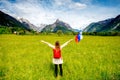 Beautiful landscape with woman holding slovenian flag Royalty Free Stock Photo