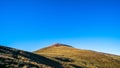 Beautiful landscape of a yellow grassland with blue sky on the high mountain at susnet I