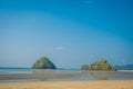 Beautiful landscapoe of two mountains in the horizont in the chicken beach at Andaman Sea, South of Thailand