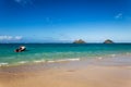 Beautiful Lanikai beach with turquoise water and a motor boat Royalty Free Stock Photo