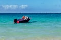 Beautiful Lanikai beach with turquoise water and a motor boat Royalty Free Stock Photo
