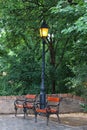 A beautiful lantern is lit in the Park, a quiet and cozy place to relax, small benches.