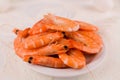 beautiful large boiled tiger prawns on a white plate on the kitchen table Royalty Free Stock Photo