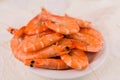 beautiful large boiled tiger prawns on a white plate on the kitchen table Royalty Free Stock Photo