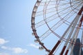 Beautiful large Ferris wheel against sky with clouds on sunny day Royalty Free Stock Photo