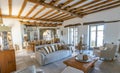 Living room interior with natural stone tiles floors and visible beam in new luxury home Royalty Free Stock Photo