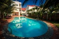 Beautiful Large Oval Pool among Palm Trees