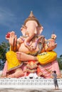 Beautiful large statue of Lord Ganesha, female asian standing and taking photo with camera at the Lord Ganesha. Narathiwat,