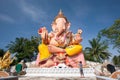 Beautiful large statue of Lord Ganesha, female asian standing and taking photo with camera at the Lord Ganesha. Narathiwat,